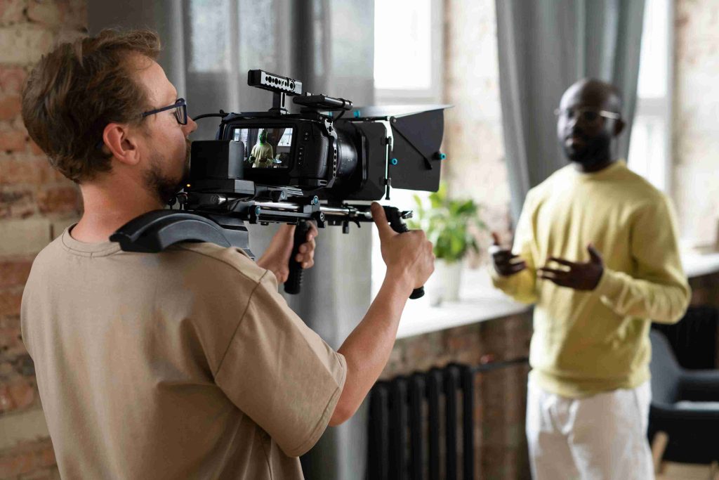 man filming with professional camera new movie