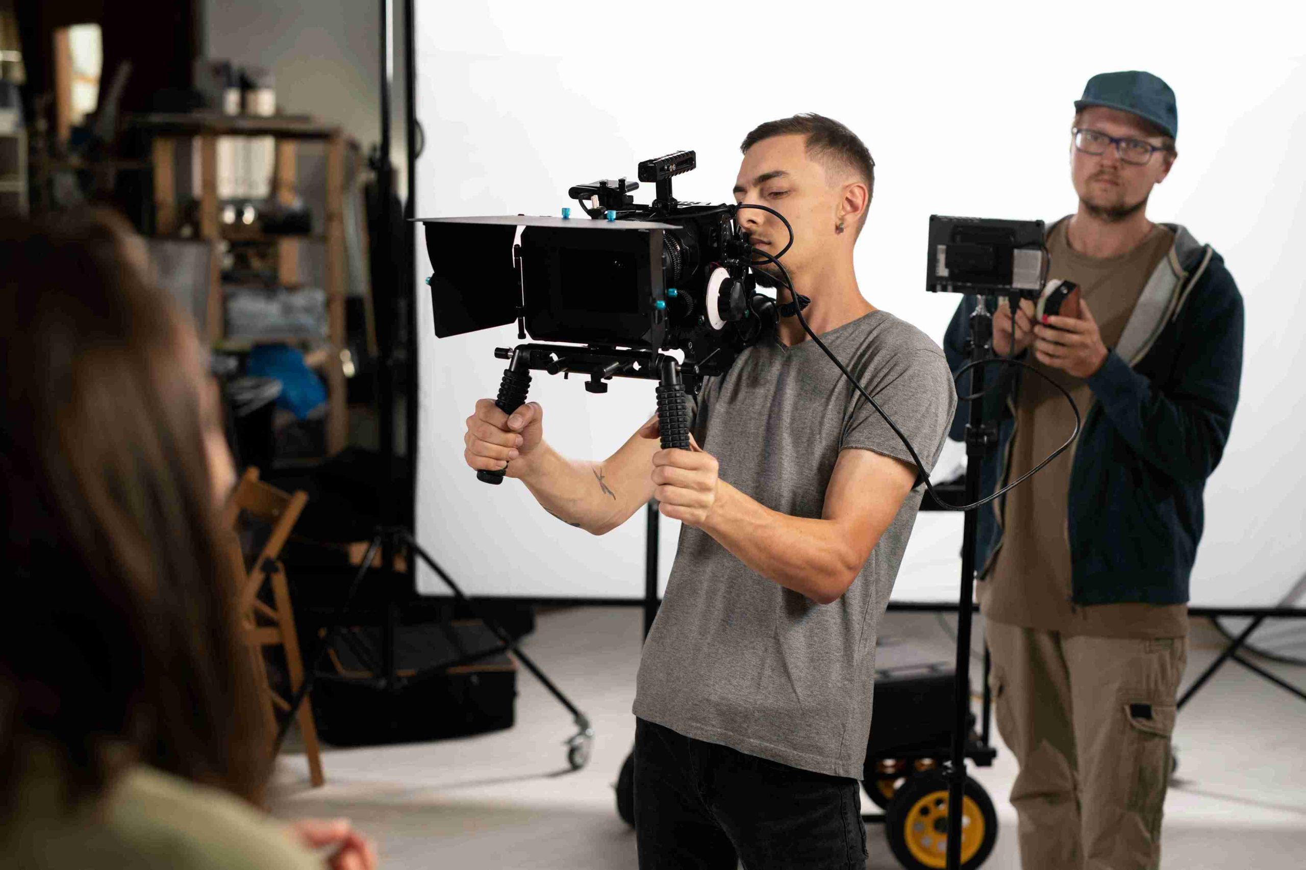 man filming with professional camera