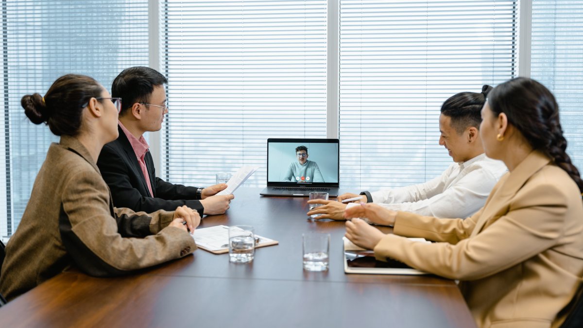 Team in a modern office using video call to communicate effectively
