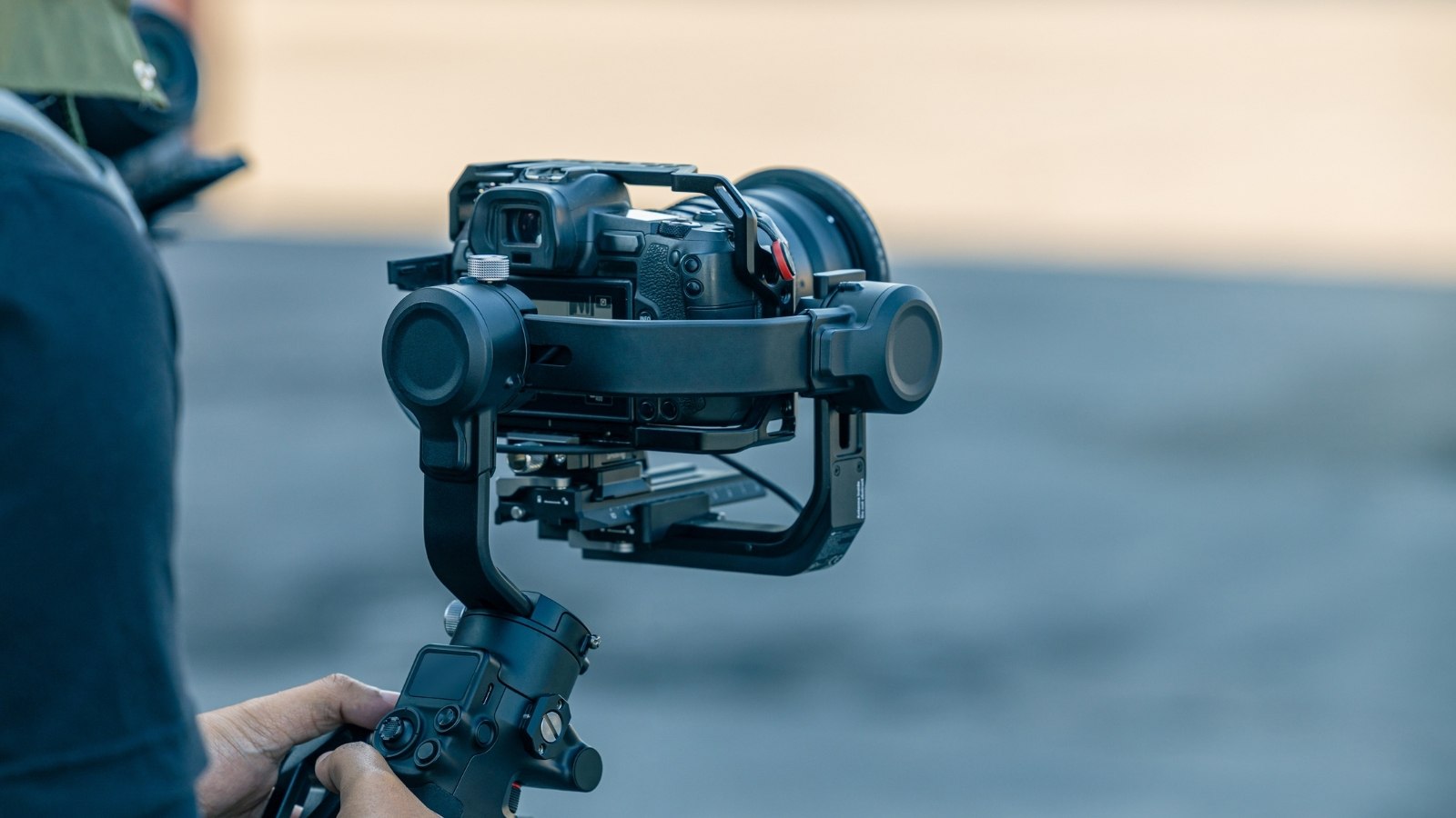 motorized 3-axis camera gimbal stabilizer holding a mirrorless digital camera